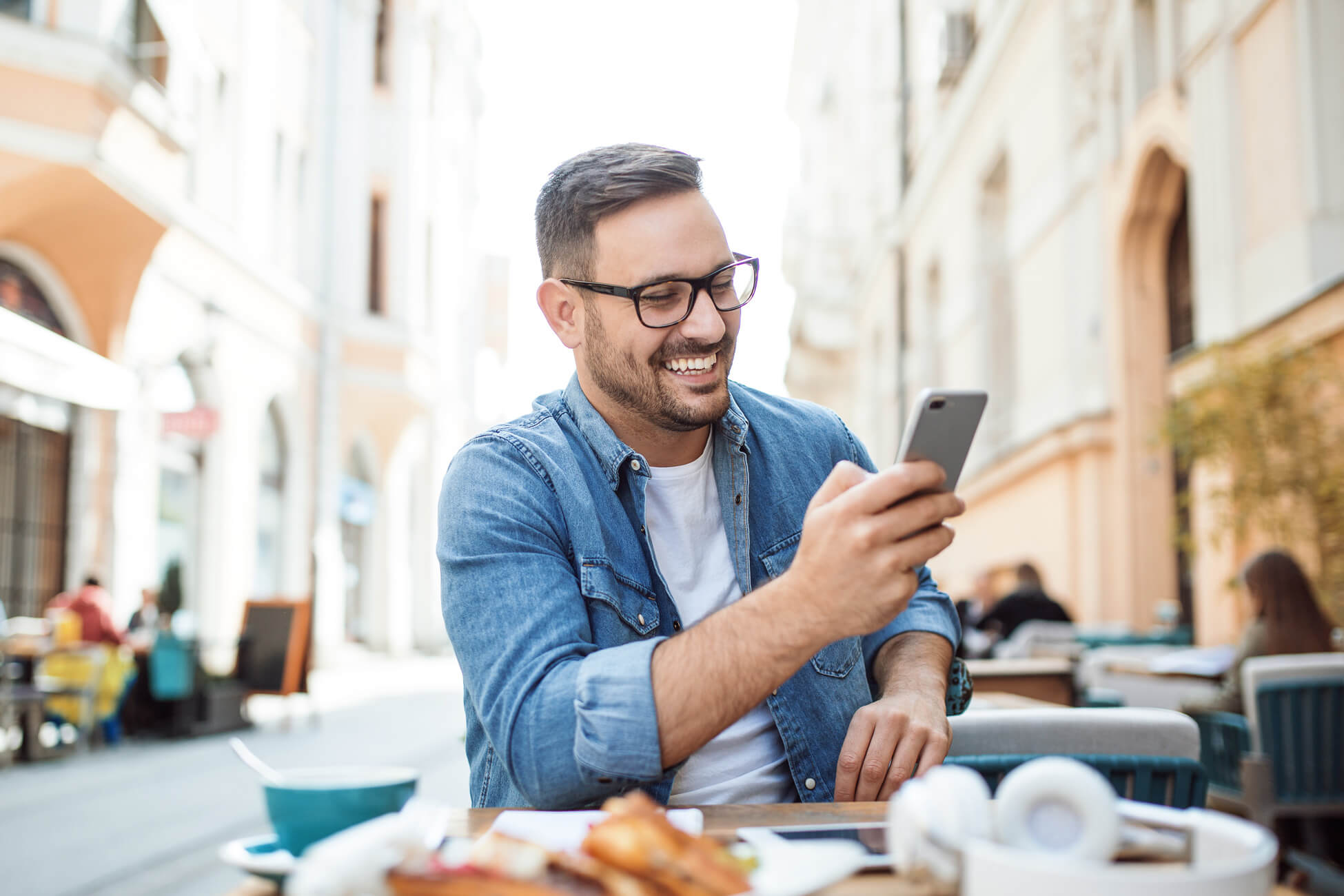 Email recipient viewing responsive html email newsletter on a mobile device.